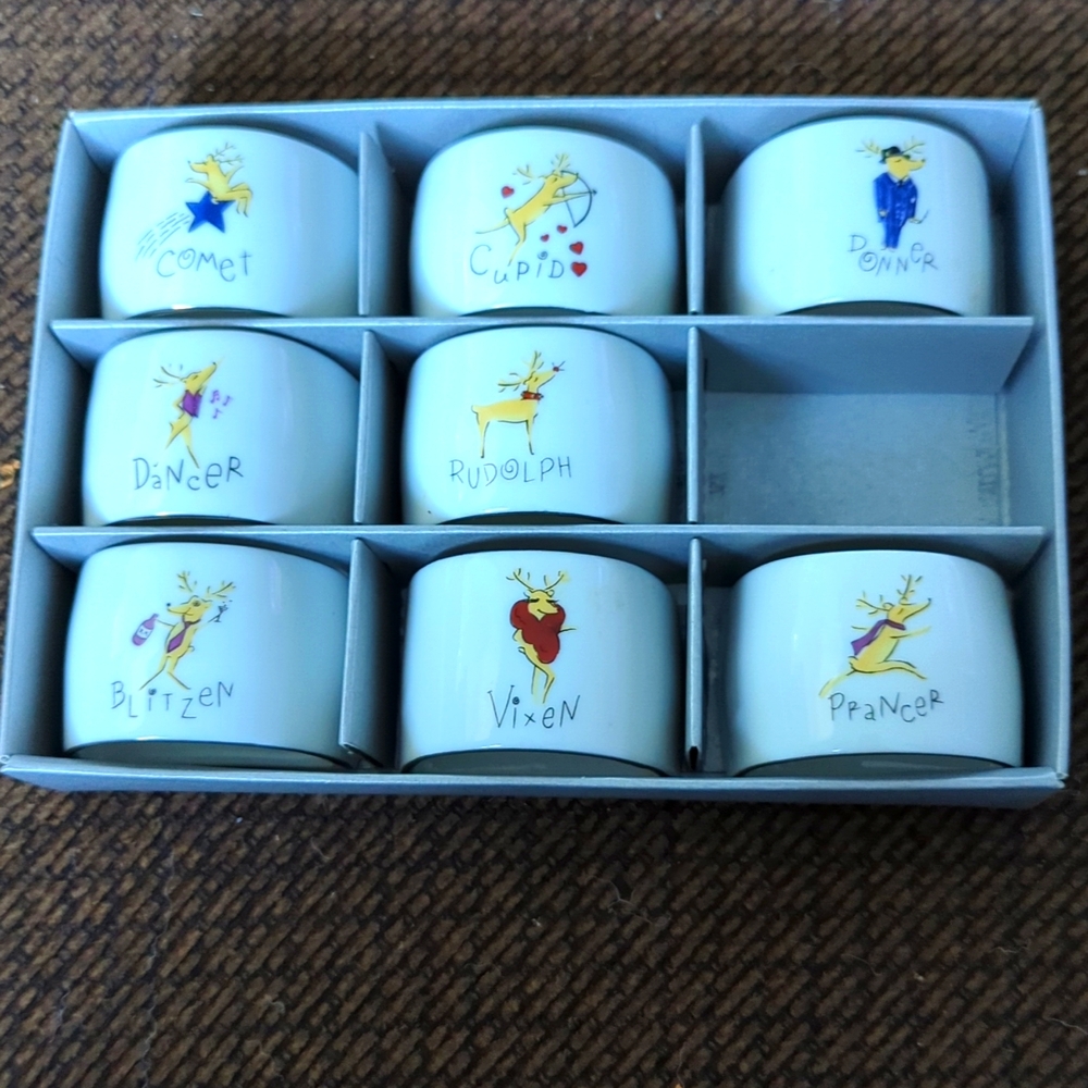 Set of eight ceramic Reindeer Napkin Rings, missing Dasher